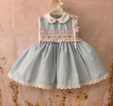 VE25-09 smocked dress in baby blue plumeti with pink embroidery
